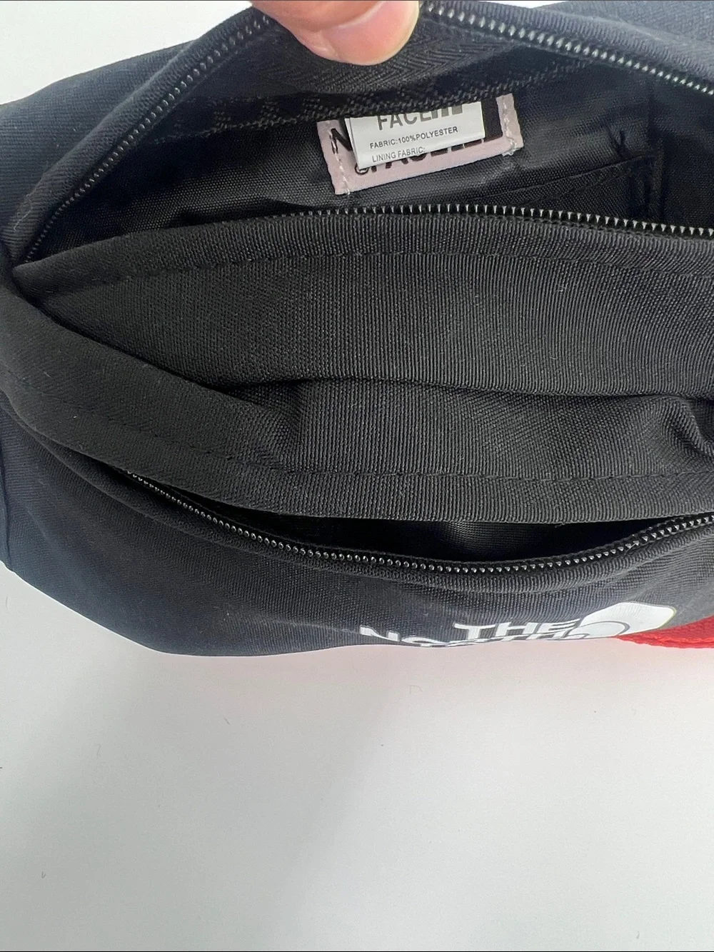 The North Face Black Belt Bag with Red Strap for Men & Women